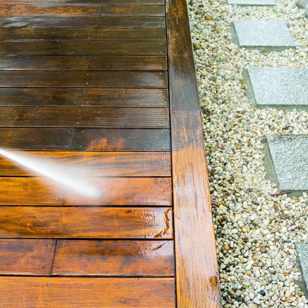 cleaning terrace with a power washer - high water pressure clean